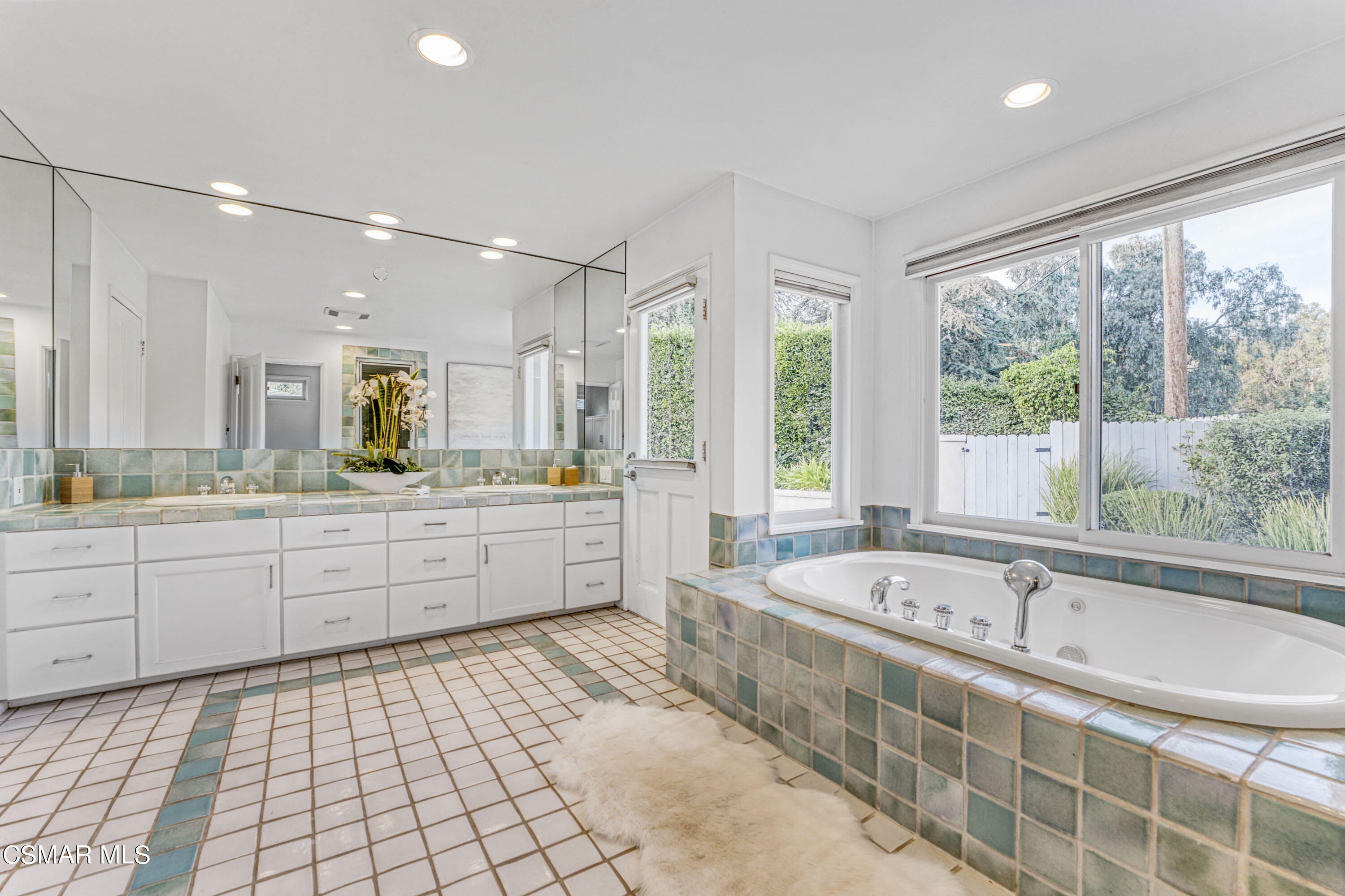 14401 Villa Woods Place Pacific Palisades, CA 90272 - Photo 14 of 46 a large bathroom with a large tub and sink