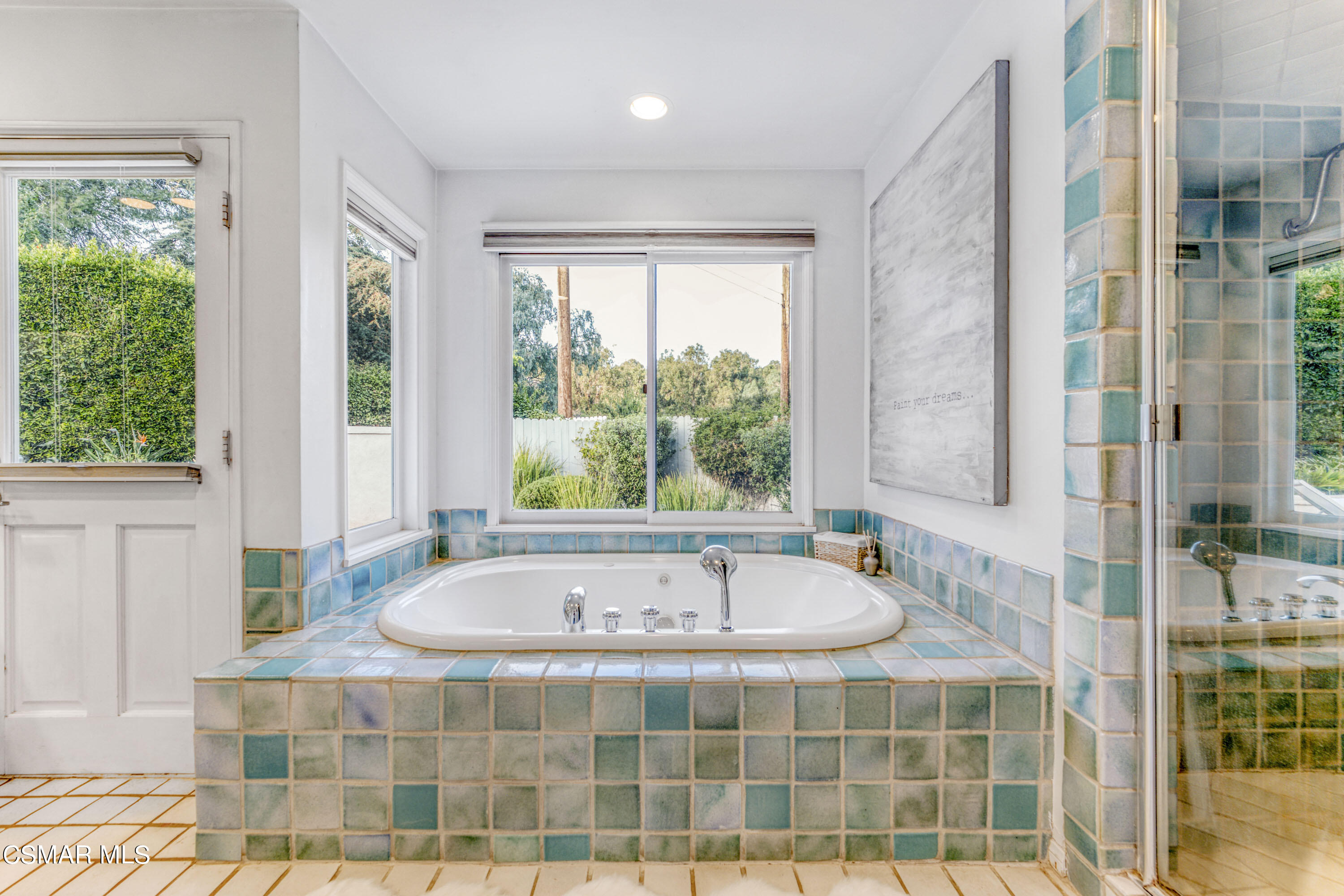 14401 Villa Woods Place Pacific Palisades, CA 90272 - Photo 15 of 46 a bath tub sitting in a bathroom next to a window