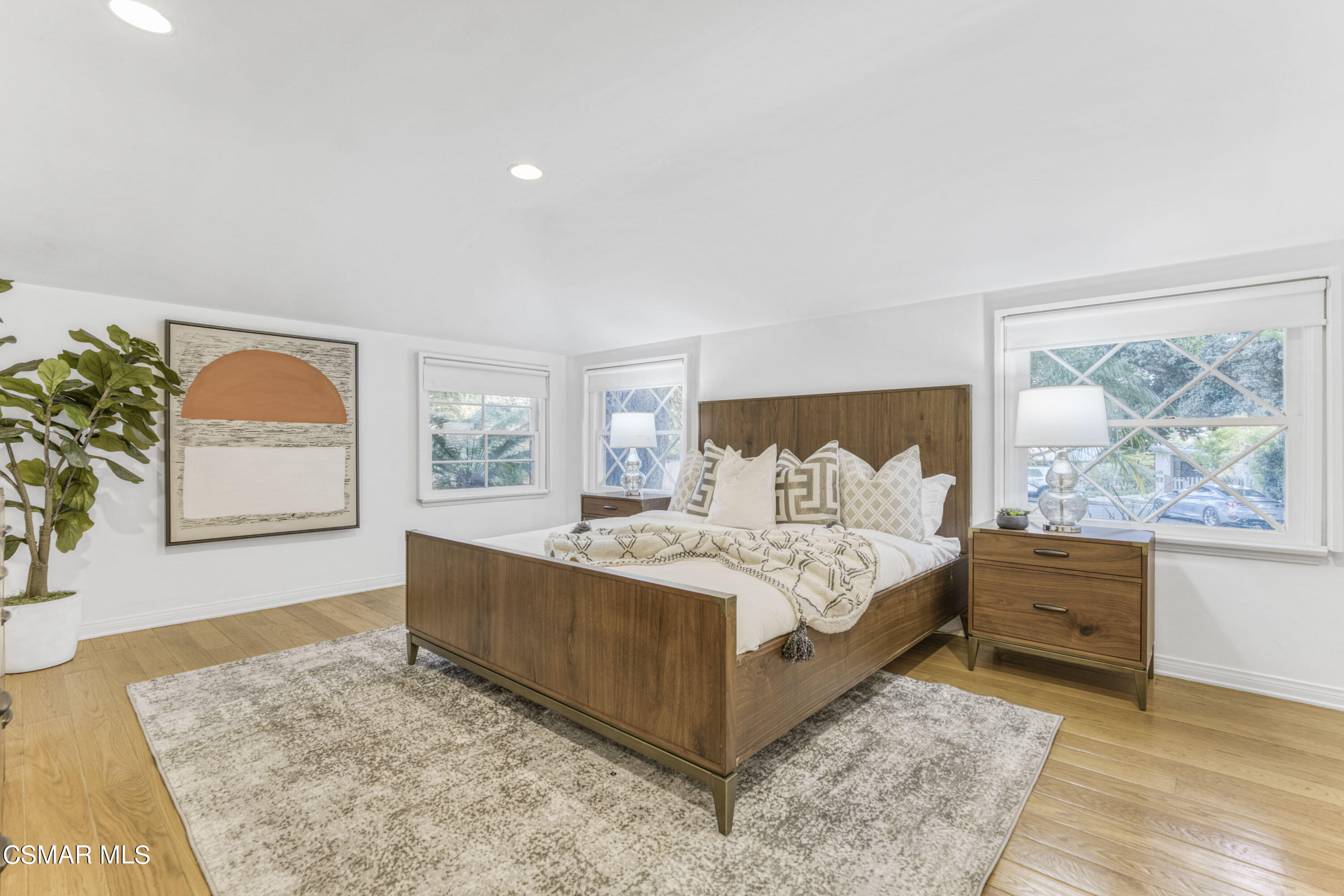 14401 Villa Woods Place Pacific Palisades, CA 90272 - Photo 19 of 46 a spacious bedroom with a bed and window