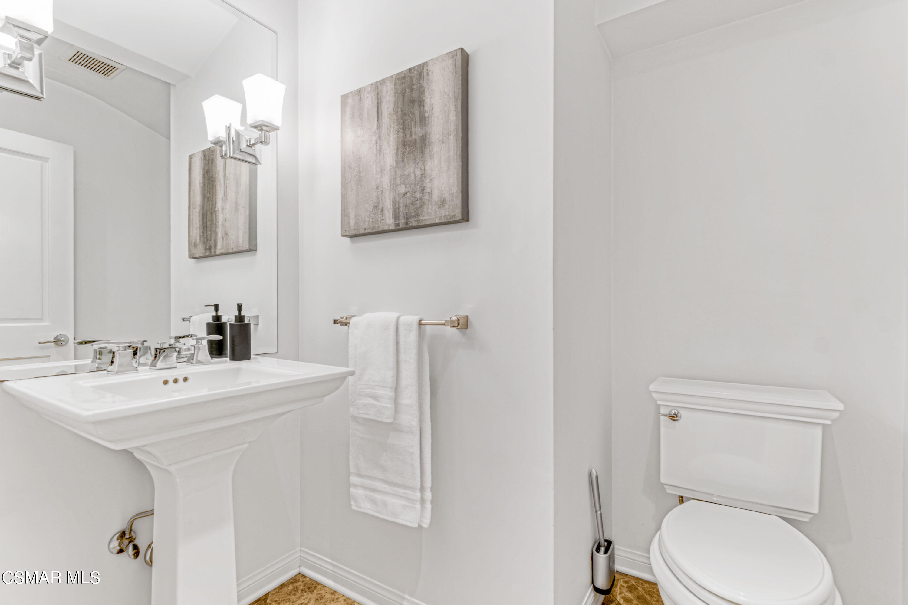 14401 Villa Woods Place Pacific Palisades, CA 90272 - Photo 22 of 46 a spacious bathroom with a toilet a sink and mirror