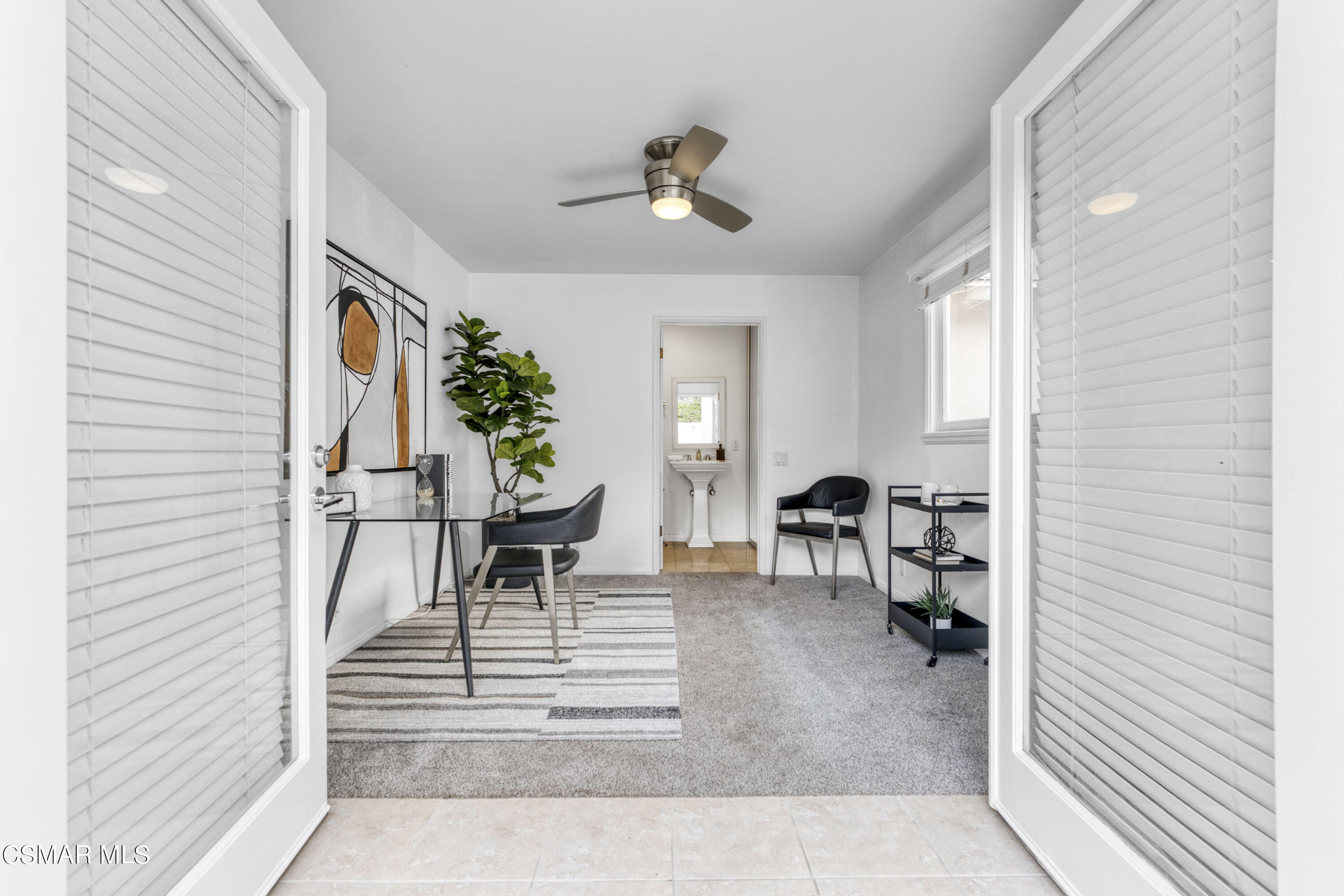 14401 Villa Woods Place Pacific Palisades, CA 90272 - Photo 23 of 46 a living room with furniture and a table