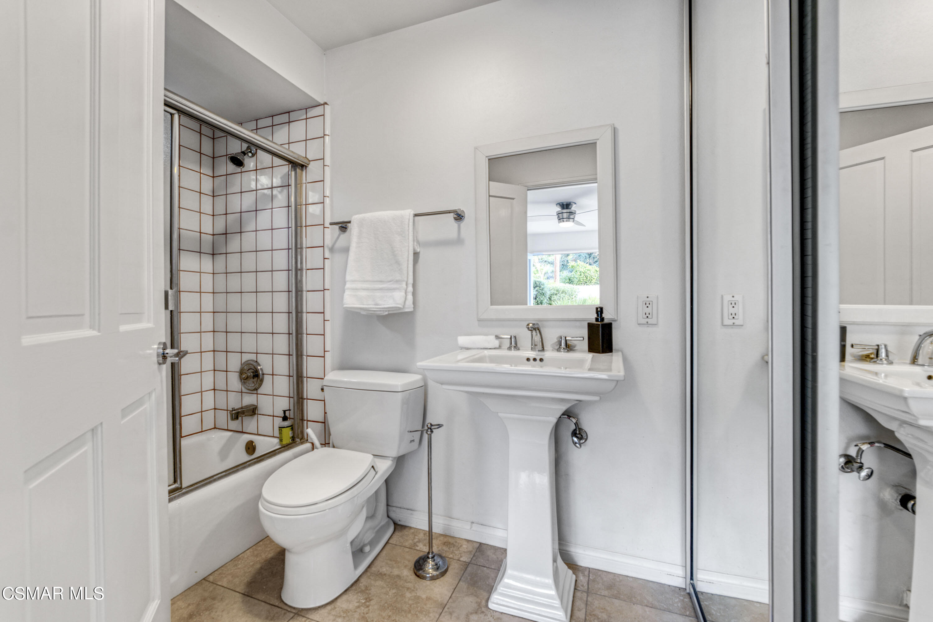 14401 Villa Woods Place Pacific Palisades, CA 90272 - Photo 25 of 46 a bathroom with a sink toilet and shower