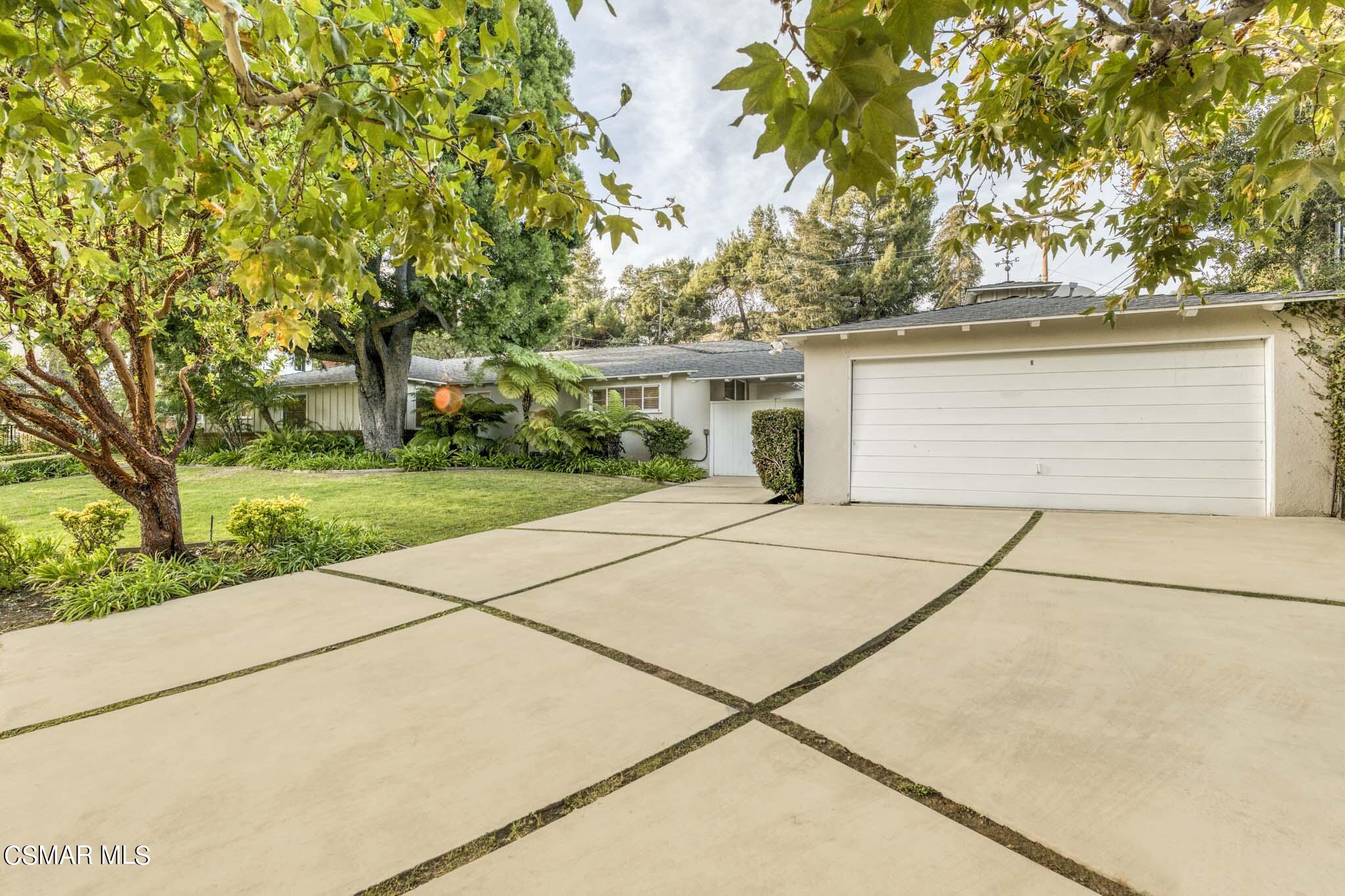 14401 Villa Woods Place Pacific Palisades, CA 90272 - Photo 29 of 46 a white house that has tree in front of it