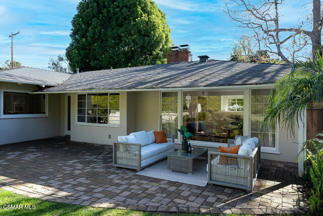 14401 Villa Woods Place Pacific Palisades, CA 90272 - Photo 3 of 46 a patio with couches table and chairs and potted plants
