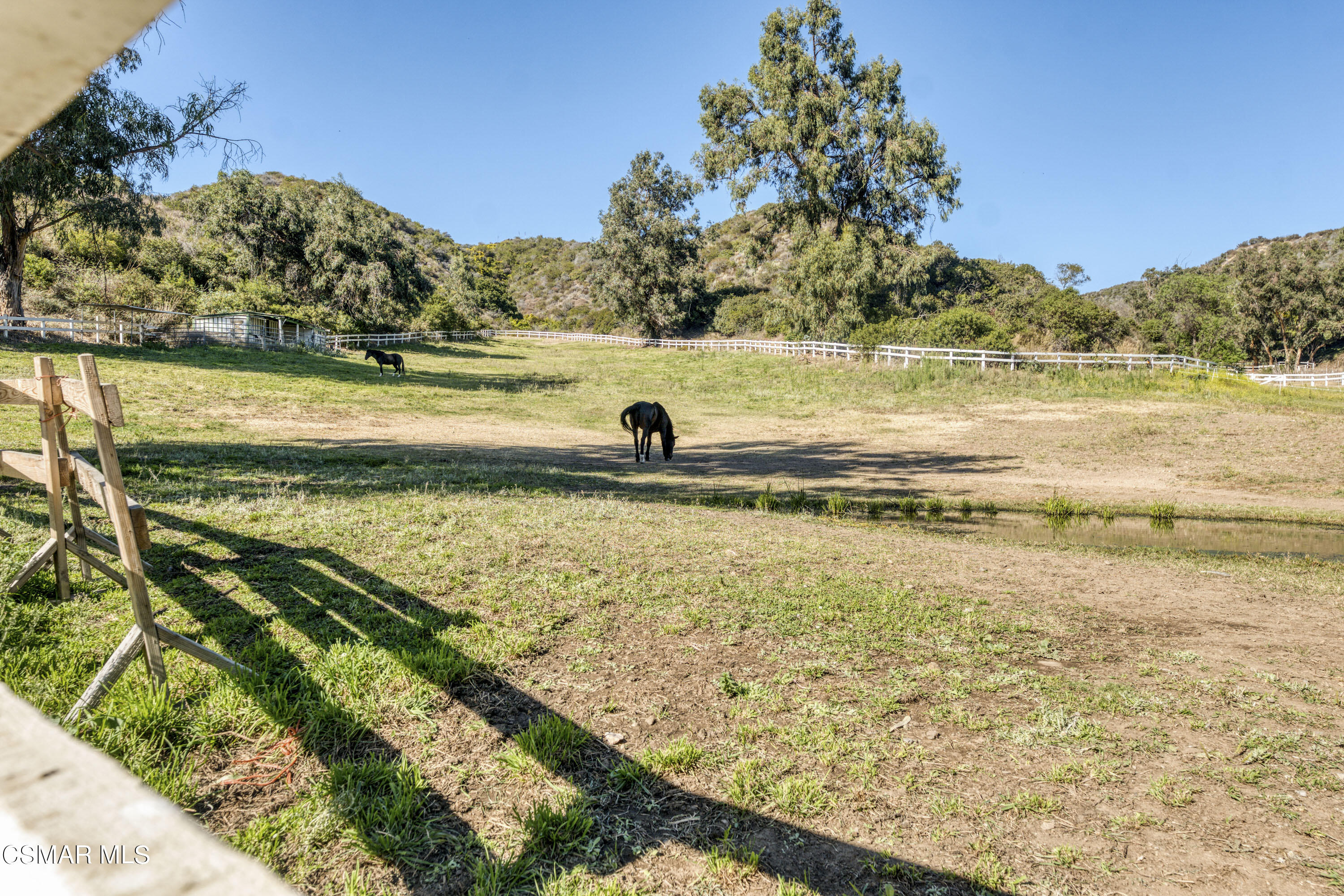 14401 Villa Woods Place Pacific Palisades, CA 90272 - Photo 40 of 46 a view of a lake with a beach