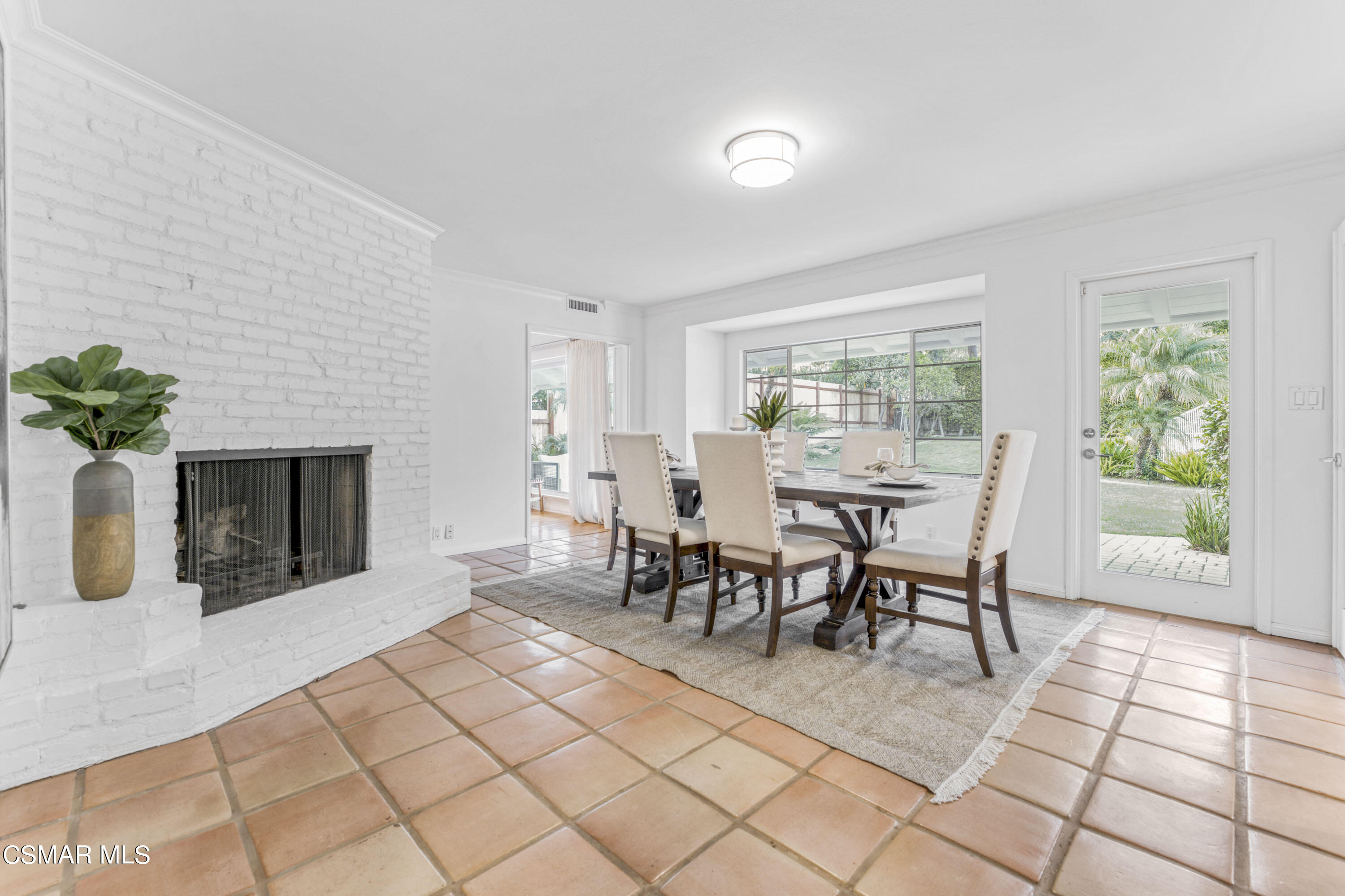14401 Villa Woods Place Pacific Palisades, CA 90272 - Photo 7 of 46 a dining room with furniture and a floor to ceiling window