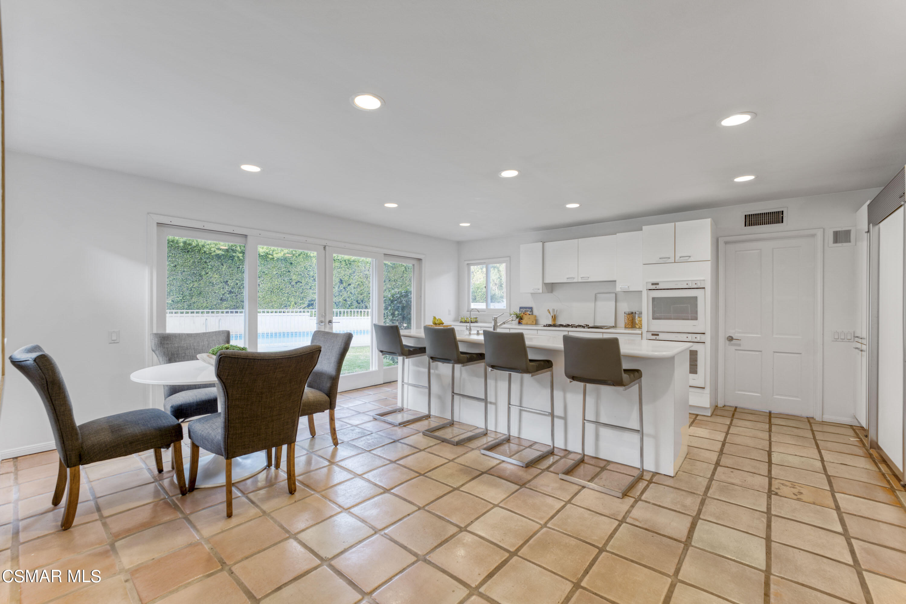 14401 Villa Woods Place Pacific Palisades, CA 90272 - Photo 8 of 46 a view of a dining room with furniture