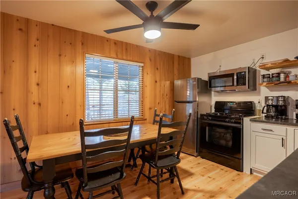 a dining room with furniture and window