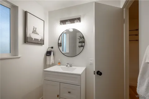a bathroom with a sink and mirror