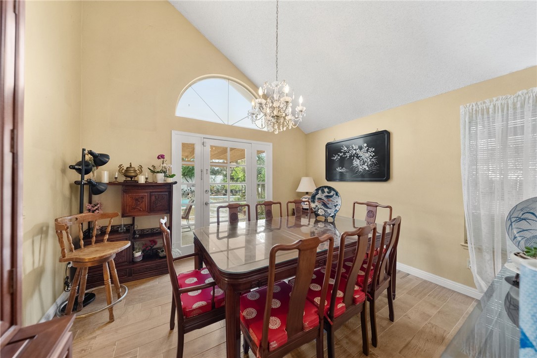 19320 Totem Court Riverside, CA 92508 - Photo 11 of 53 Light-filled dining area with chandelier and French doors leading to the covered patio for indoor-outdoor entertaining.