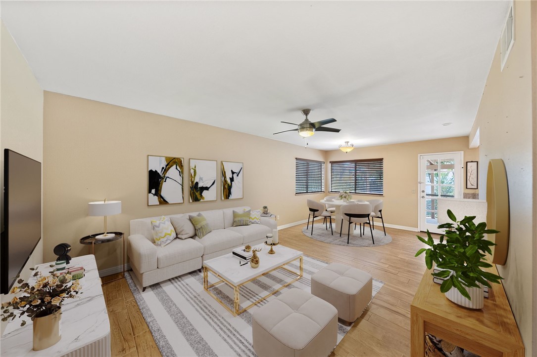 19320 Totem Court Riverside, CA 92508 - Photo 19 of 53 Artificial rendering: Versatile family room with ceiling fan, abundant wall space, and a comfortable layout for everyday living.