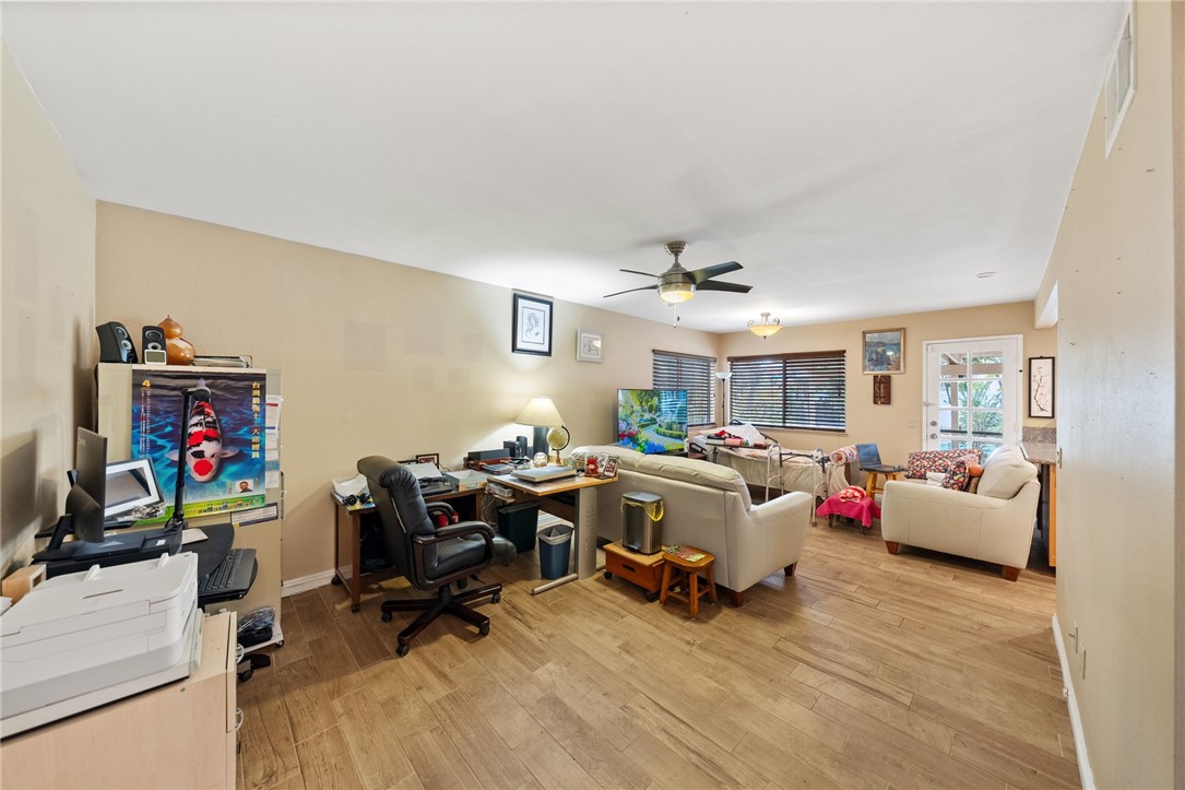 19320 Totem Court Riverside, CA 92508 - Photo 20 of 53 Expanded view showing the room’s generous size and flexible space for media, work, or hobbies.