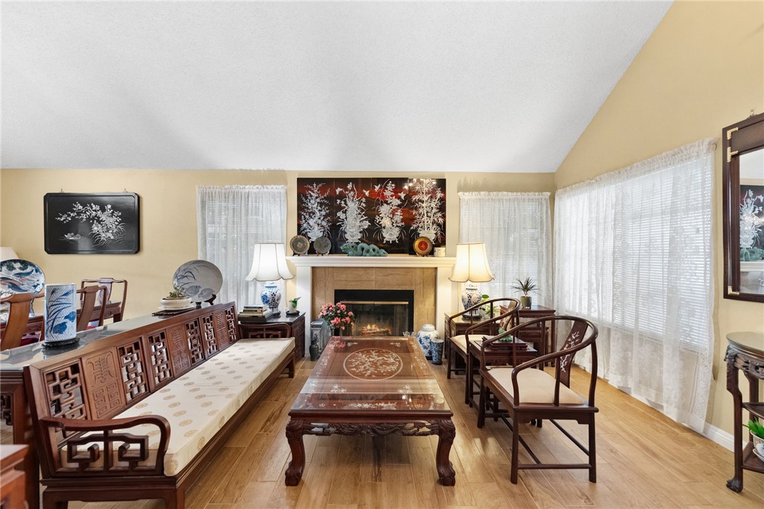 19320 Totem Court Riverside, CA 92508 - Photo 10 of 53 Another view of the inviting living space featuring the fireplace, multiple windows, and an easy flow to the dining area.