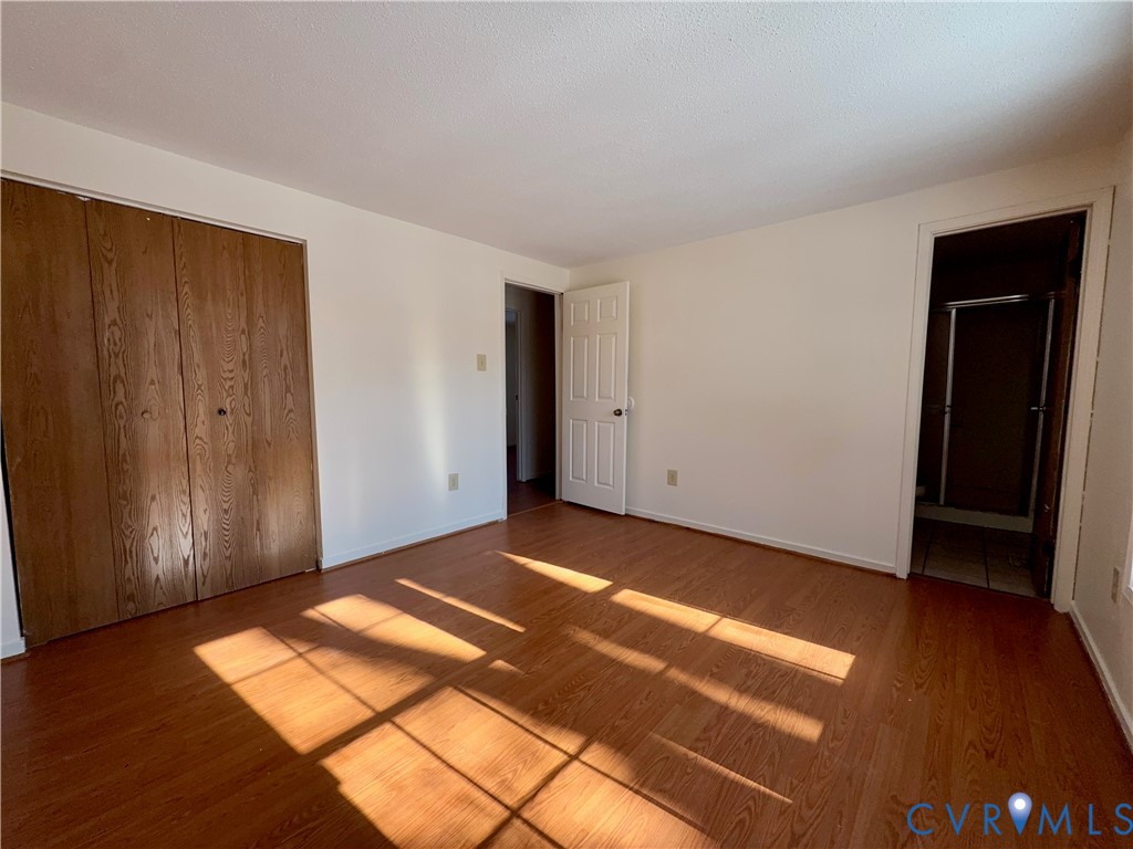3901 Old Warwick Road Richmond, VA 23234 - Photo 18 of 21 Unfurnished bedroom featuring wood finished floors