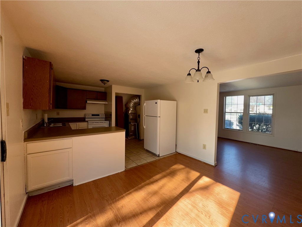 3901 Old Warwick Road Richmond, VA 23234 - Photo 5 of 21 Kitchen with white appliances, dark countertops, l