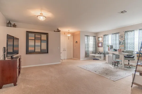 a kitchen with stainless steel appliances granite countertop a sink a stove and cabinets
