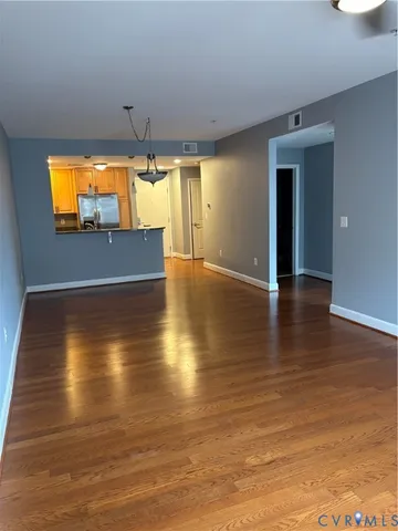 a view of empty room with a flat screen tv