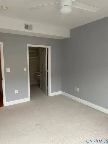 an empty room with closet area