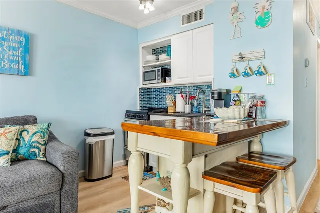 a room with furniture and painting on the wall