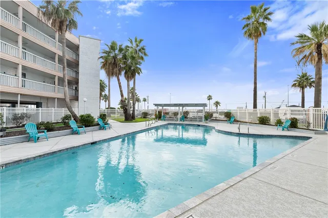 a view of a swimming pool with a lounge chairs