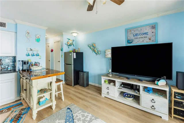 a room with furniture and flat screen tv