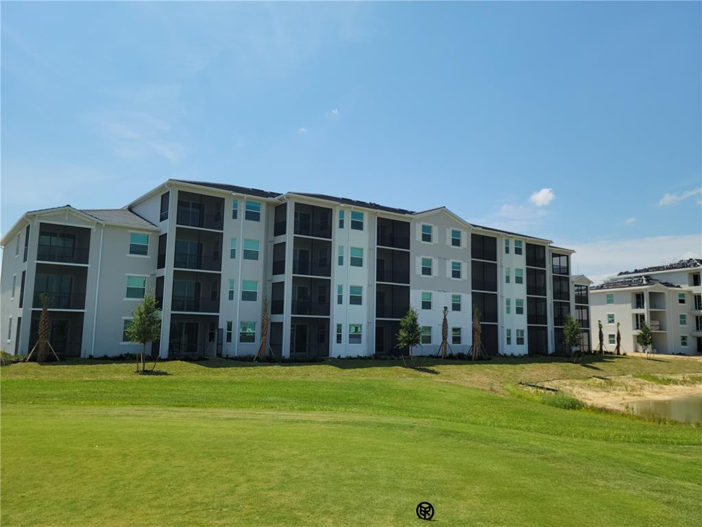 43997 Boardwalk Loop, Unit 1823 Punta Gorda, FL 33982 - Photo 1 of 1 a view of a house with a backyard