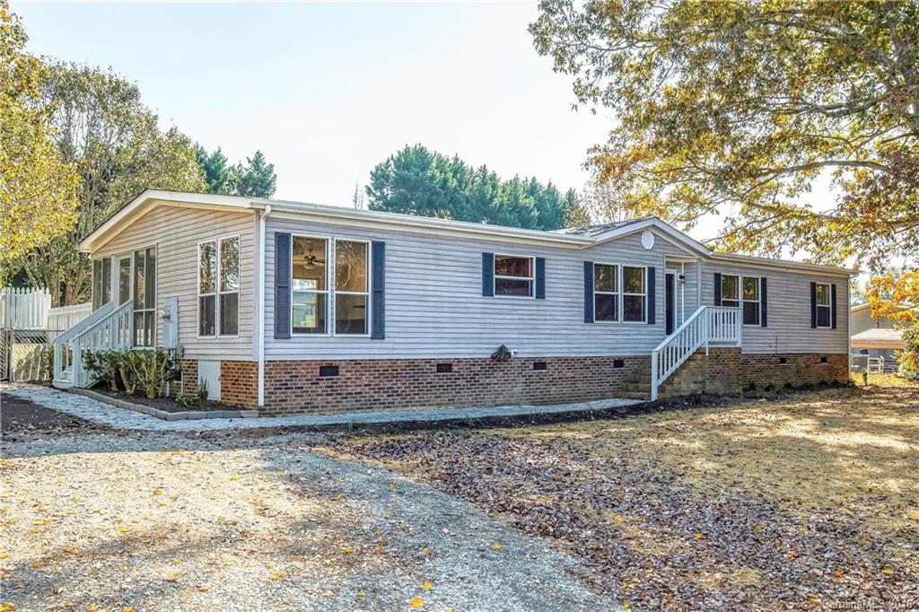 1815 Crowder Road Monroe, NC 28112 - Photo 1 of 24 a front view of a house with a yard