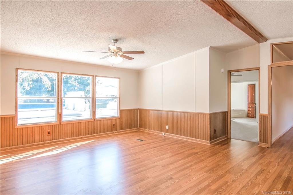 1815 Crowder Road Monroe, NC 28112 - Photo 7 of 24 a view of empty room with wooden floor and fan