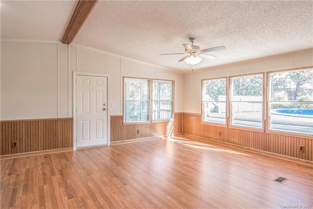 1815 Crowder Road Monroe, NC 28112 - Photo 8 of 24 a view of an empty room with a window and wooden floor