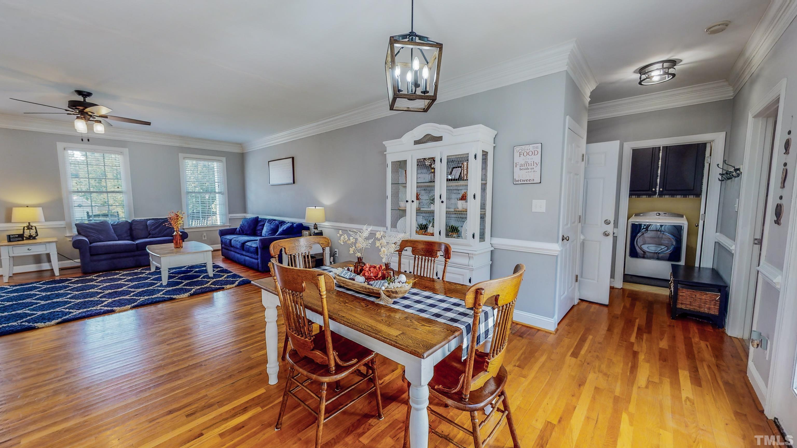226 Fletcher Ridge Road Timberlake, NC 27583 - Photo 18 of 54 a view of a dining room with furniture wooden floor and chandelier