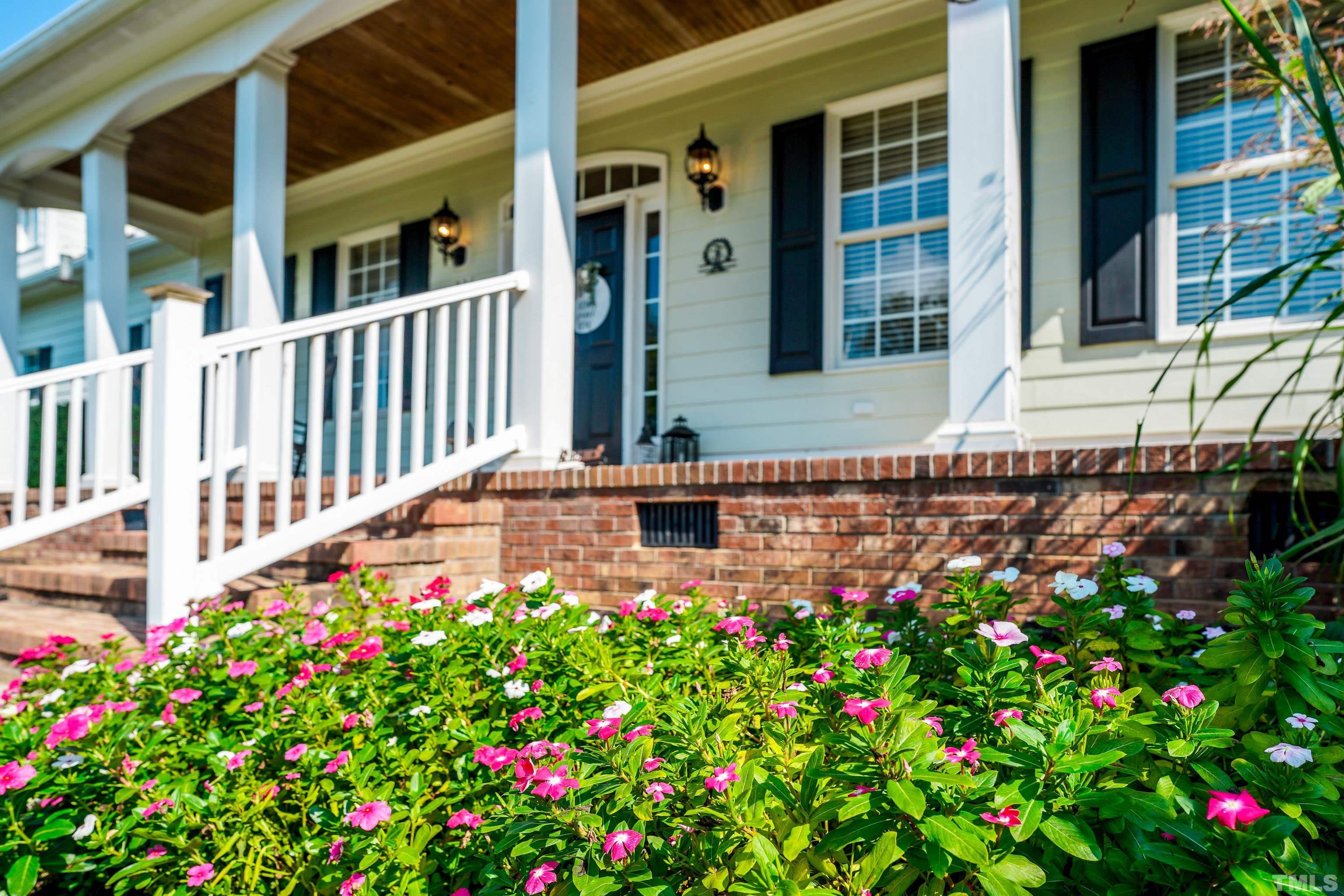 226 Fletcher Ridge Road Timberlake, NC 27583 - Photo 20 of 54 a view of a house with flower garden