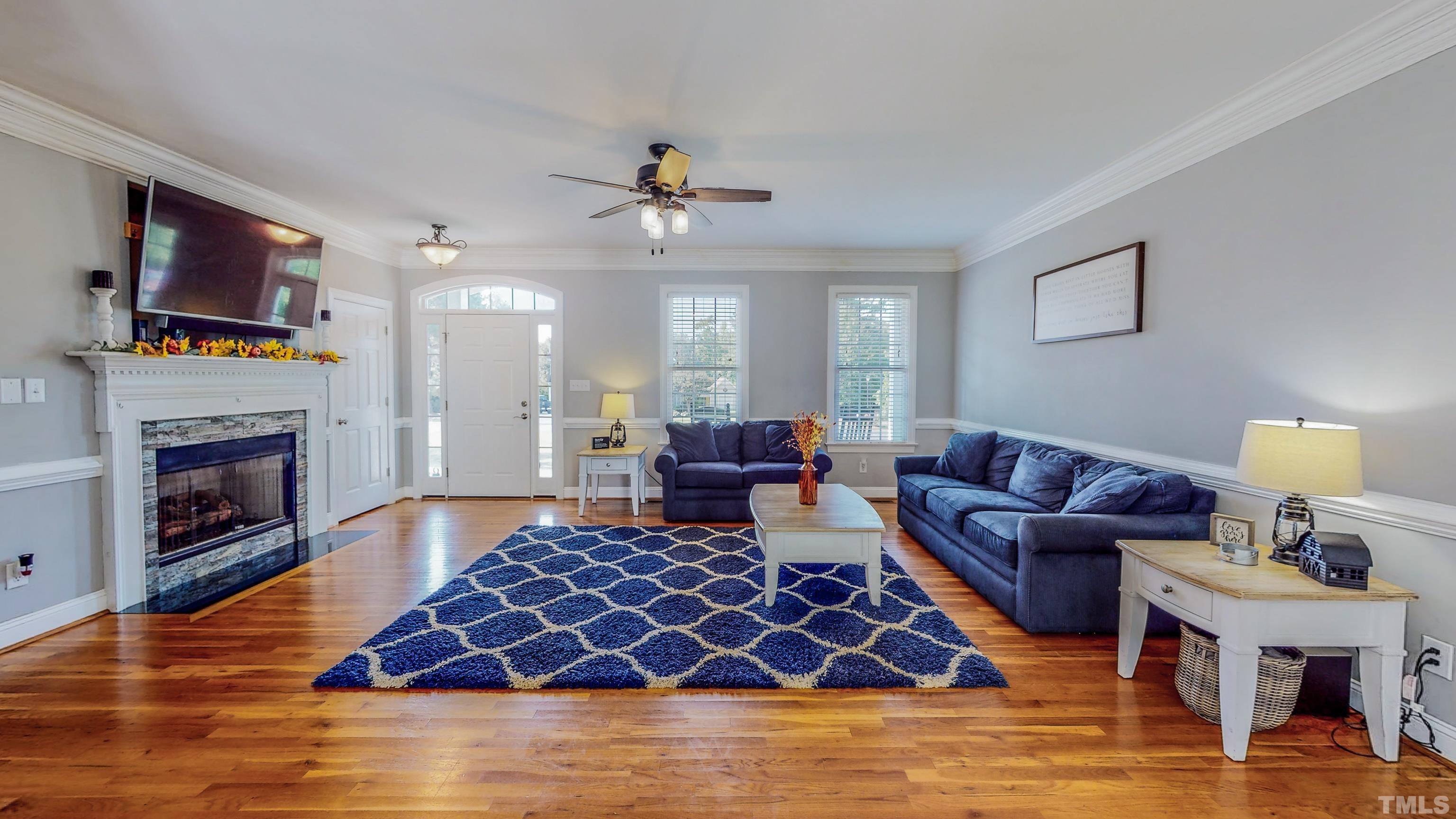 226 Fletcher Ridge Road Timberlake, NC 27583 - Photo 2 of 54 a living room with furniture and a fireplace