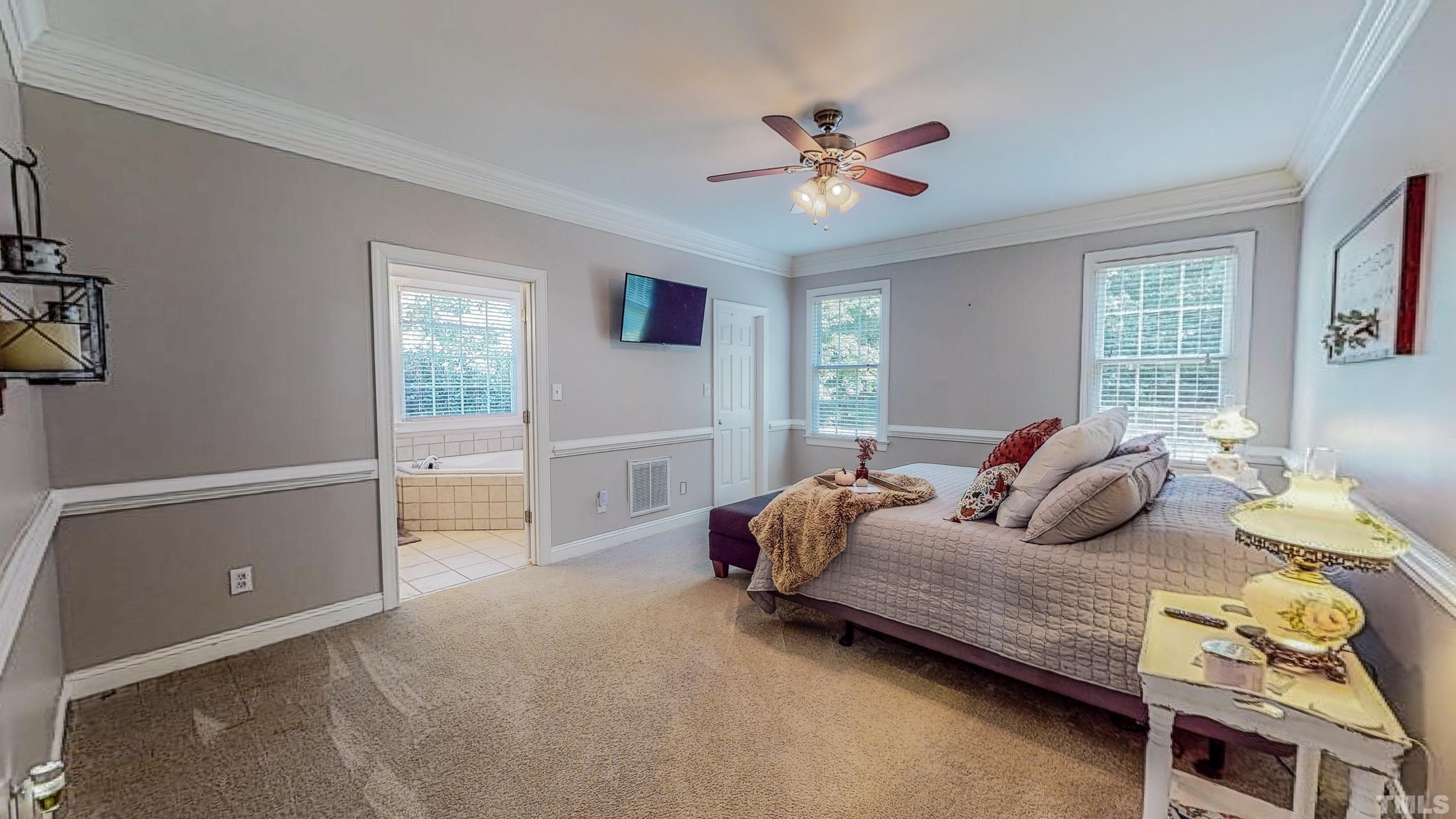 226 Fletcher Ridge Road Timberlake, NC 27583 - Photo 22 of 54 a bedroom with bed and window