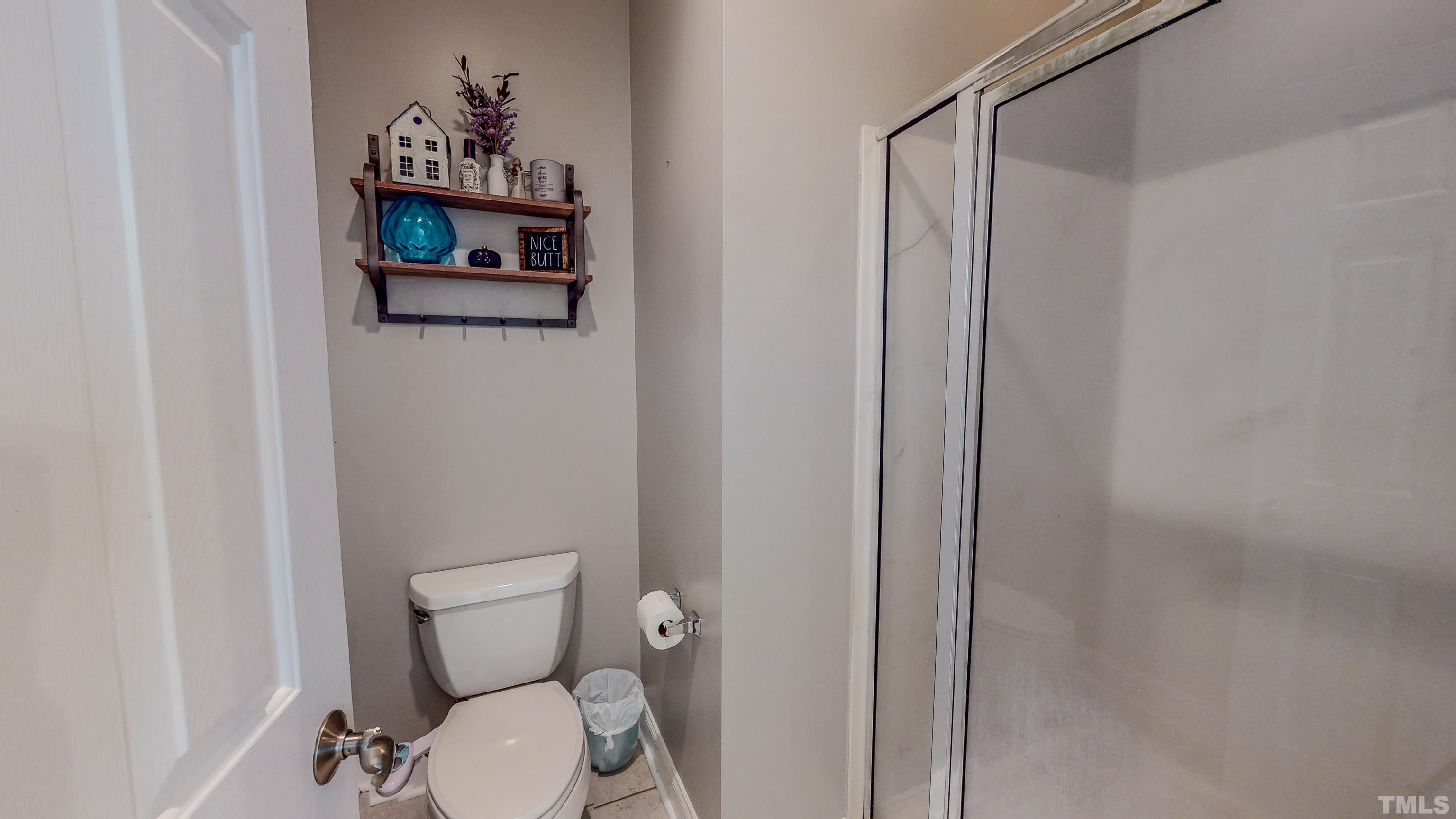 226 Fletcher Ridge Road Timberlake, NC 27583 - Photo 29 of 54 a white toilet sitting next to a small bathroom