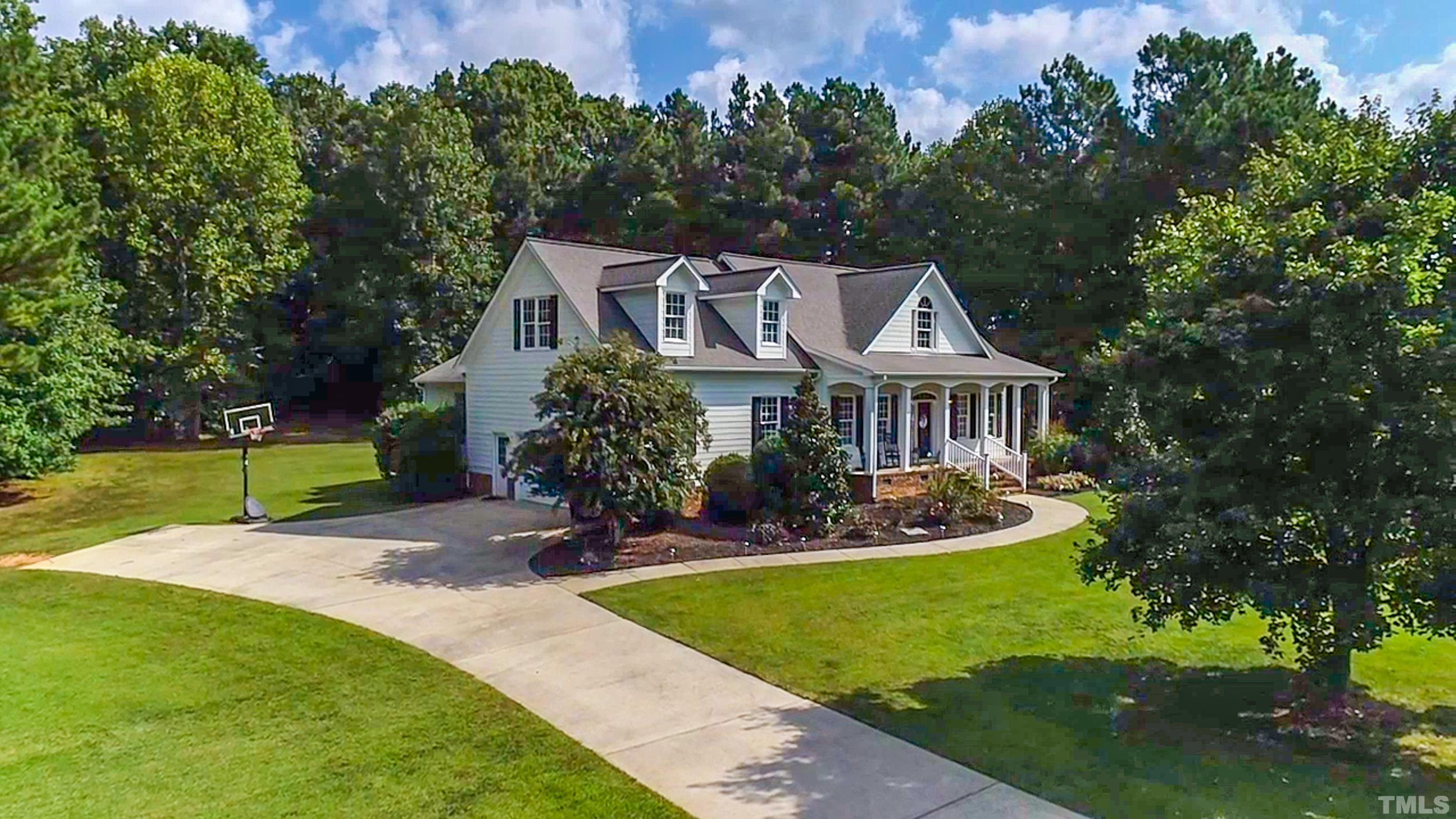 226 Fletcher Ridge Road Timberlake, NC 27583 - Photo 30 of 54 a front view of a house with garden