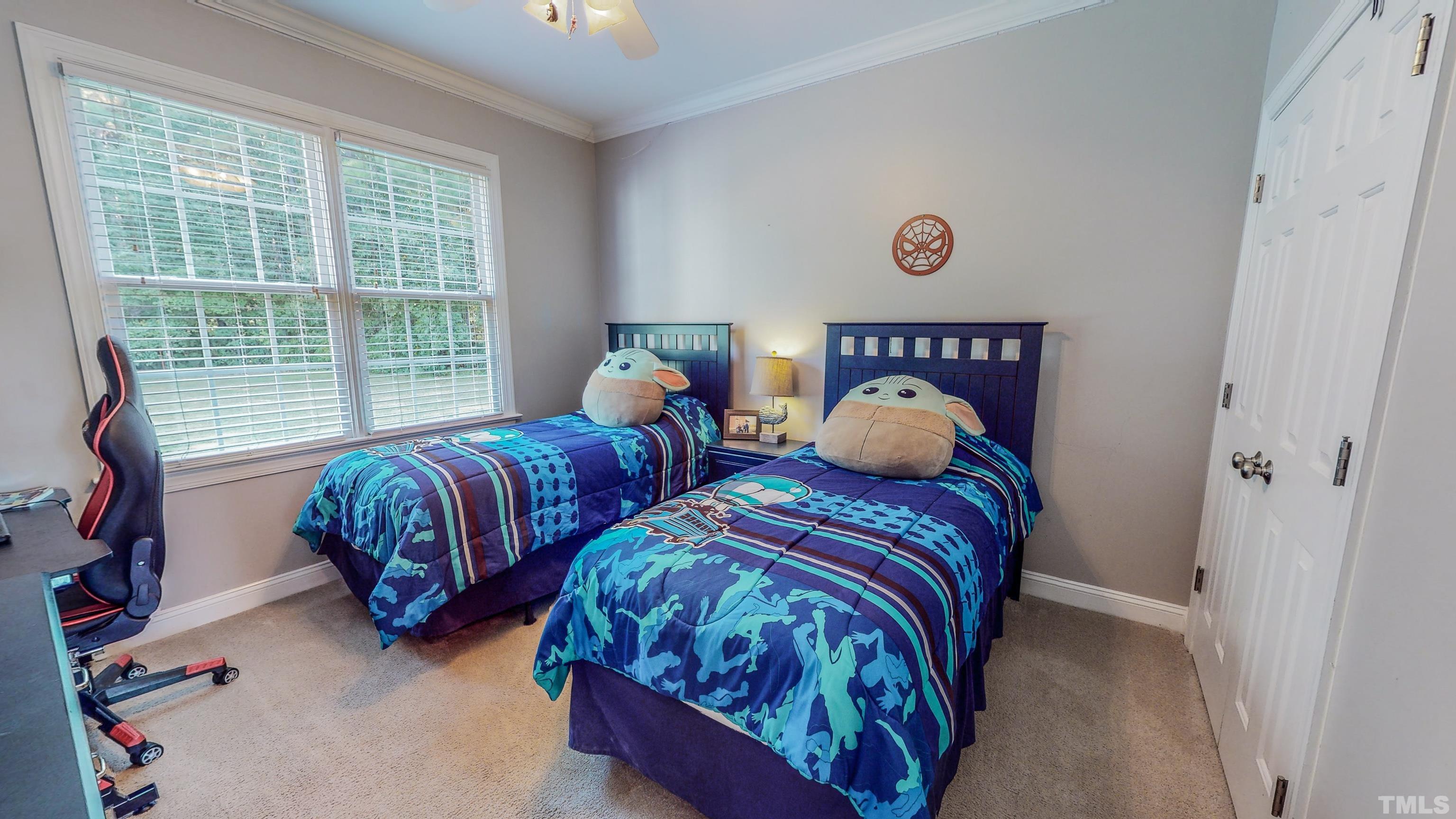 226 Fletcher Ridge Road Timberlake, NC 27583 - Photo 37 of 54 a bedroom with two beds and a large window