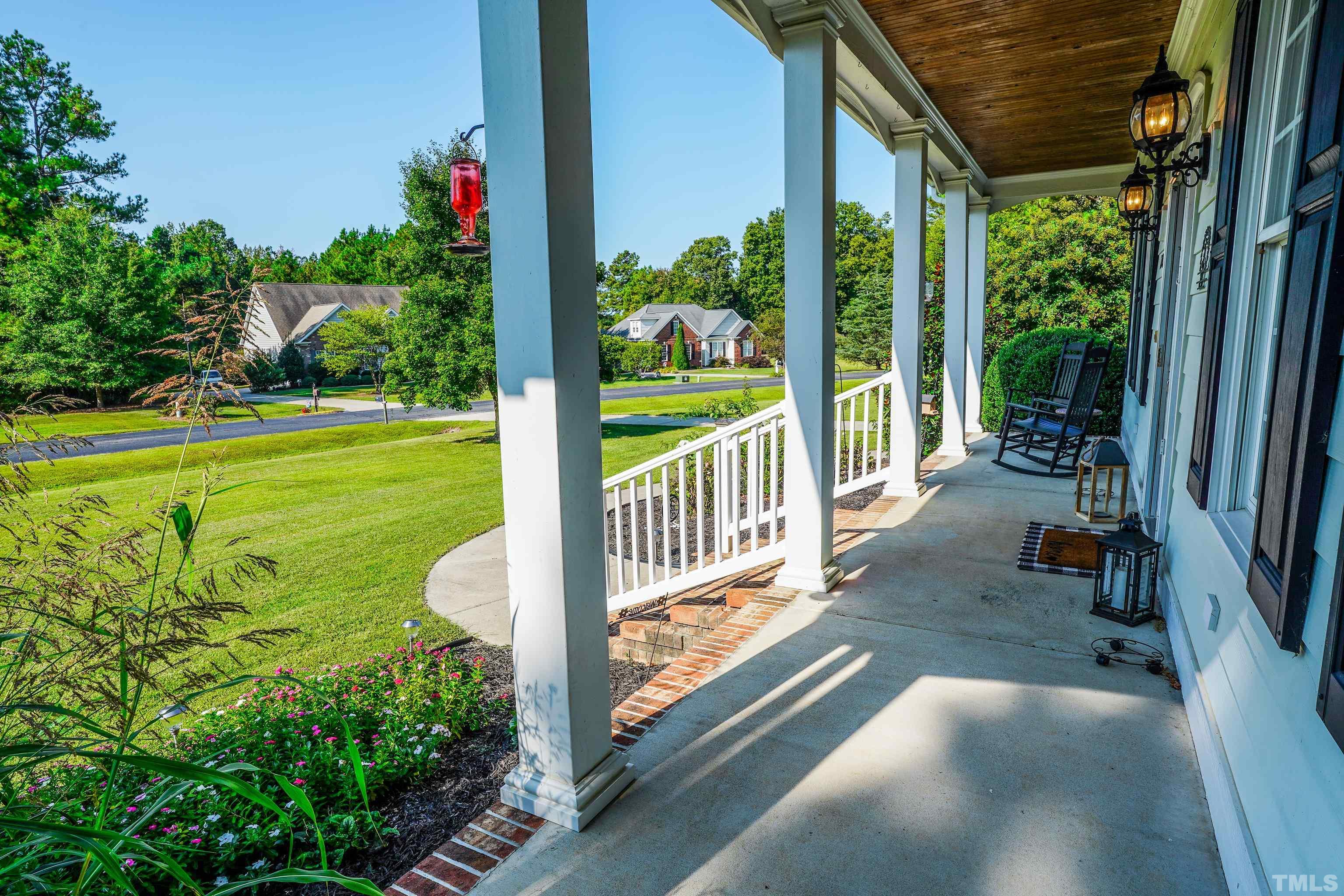 226 Fletcher Ridge Road Timberlake, NC 27583 - Photo 39 of 54 a view of a porch with chairs and backyard