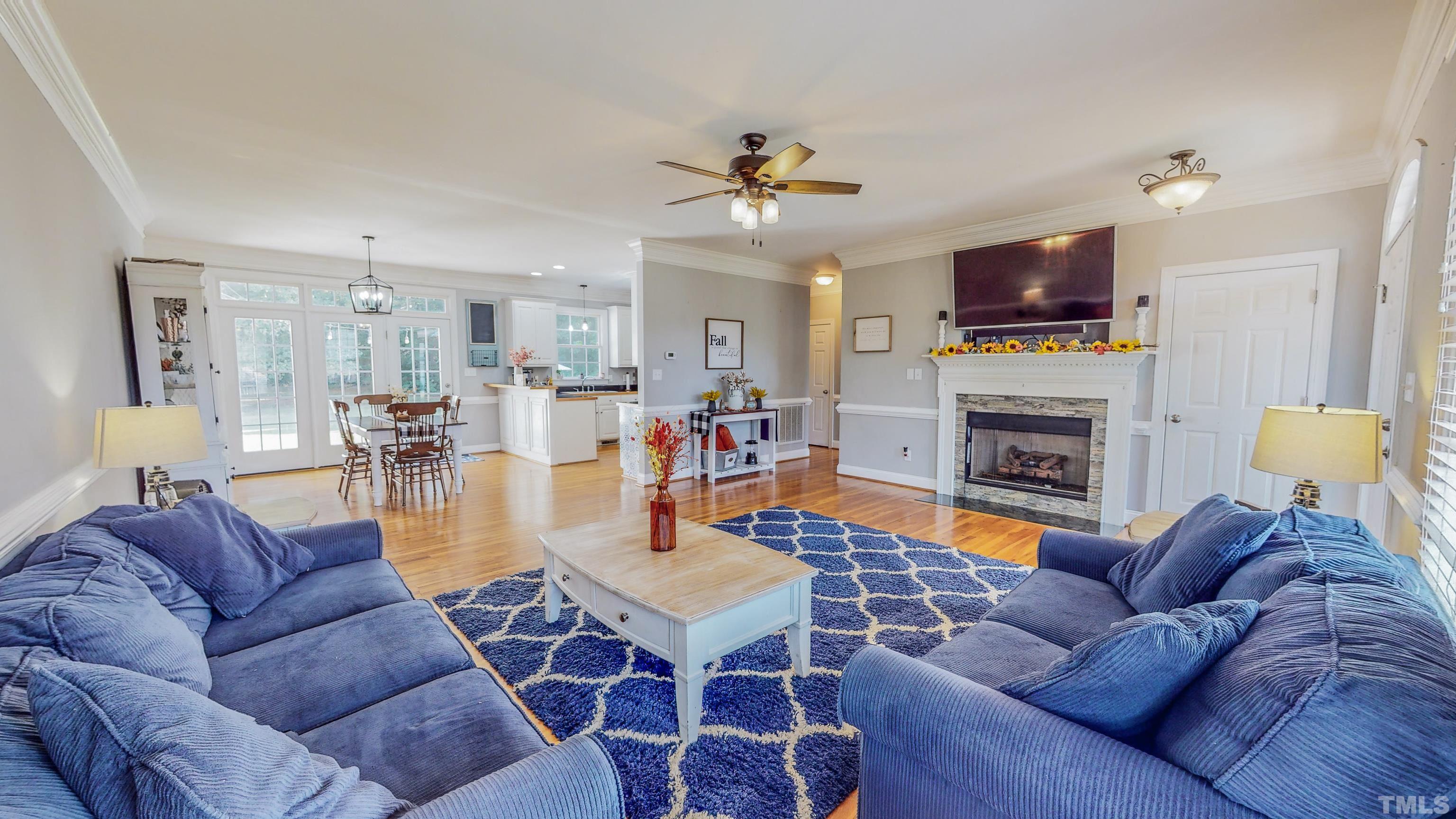 226 Fletcher Ridge Road Timberlake, NC 27583 - Photo 5 of 54 a living room with fireplace furniture and a flat screen tv
