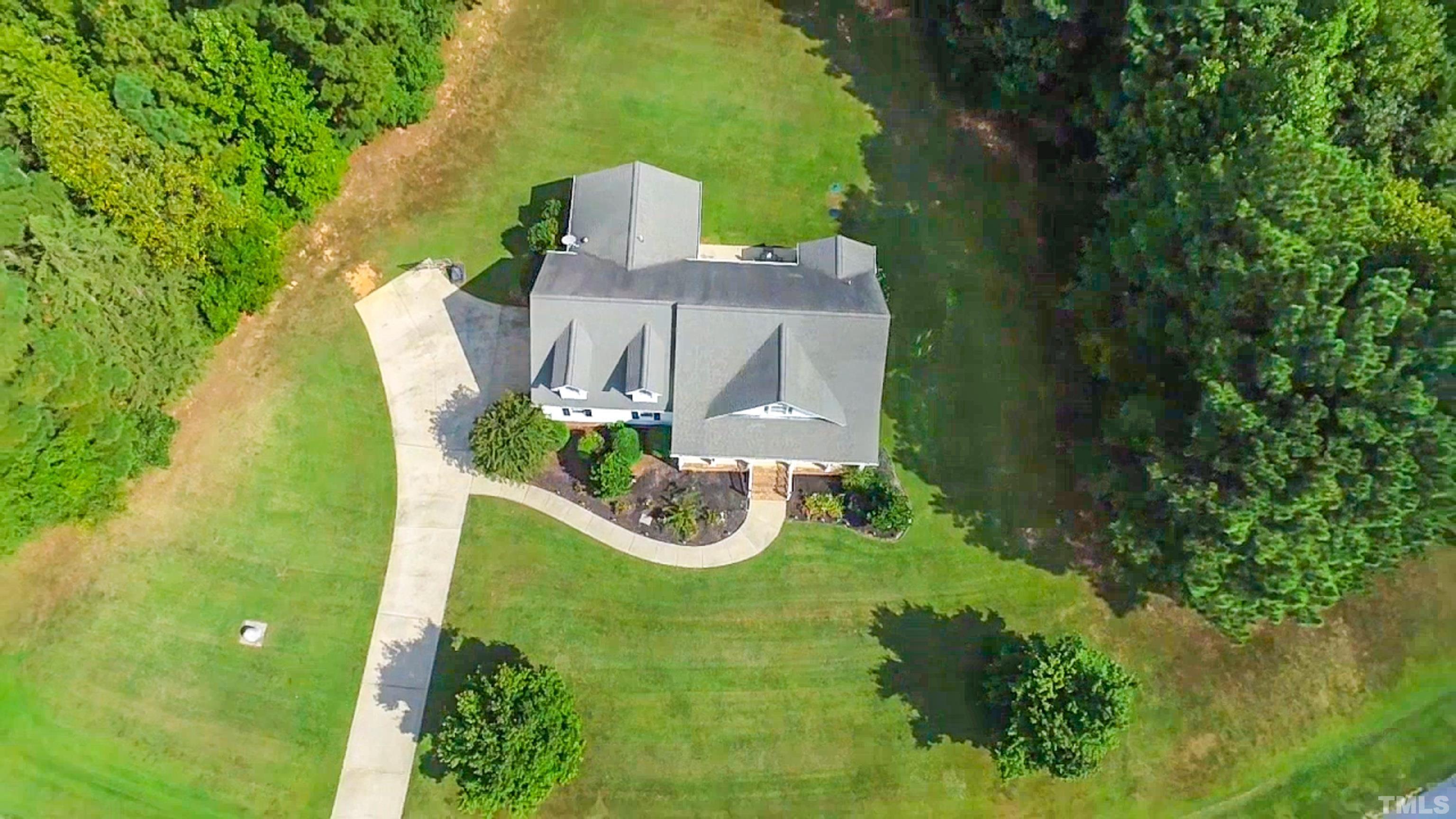 226 Fletcher Ridge Road Timberlake, NC 27583 - Photo 53 of 54 a view of a house with a yard