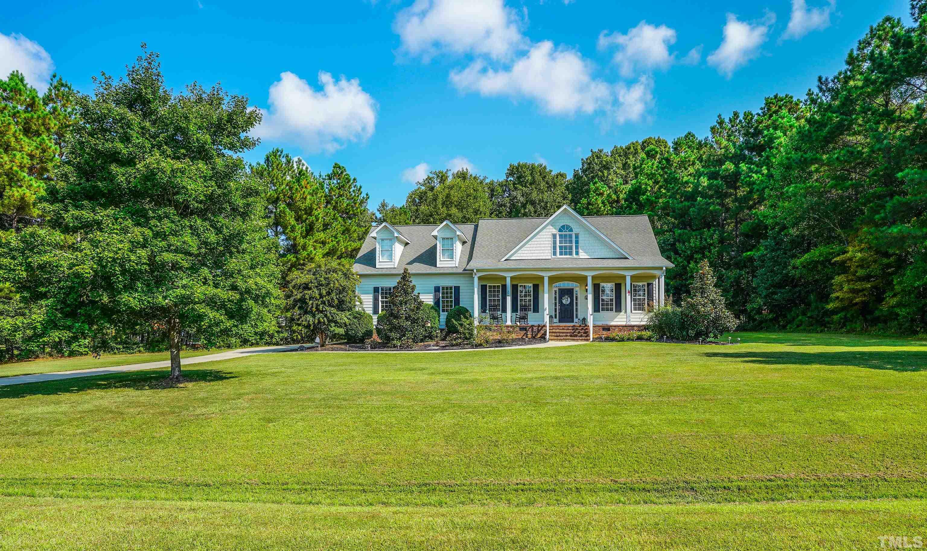 226 Fletcher Ridge Road Timberlake, NC 27583 - Photo 54 of 54 a front view of a house with a garden