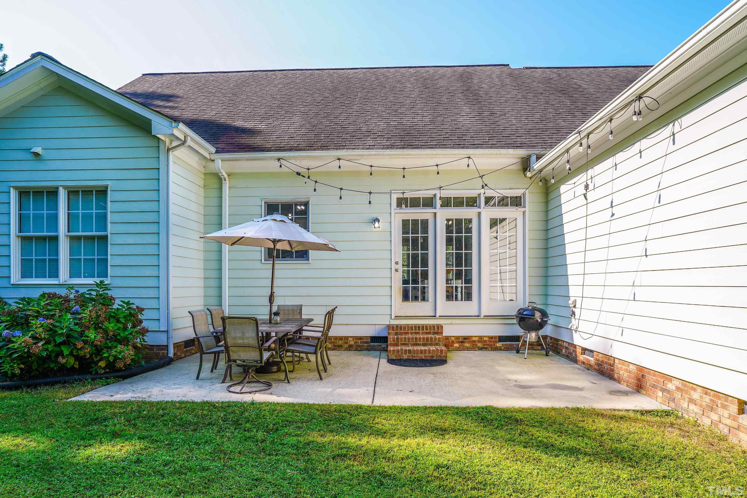 226 Fletcher Ridge Road Timberlake, NC 27583 - Photo 6 of 54 a view of a house with backyard sitting area and garden
