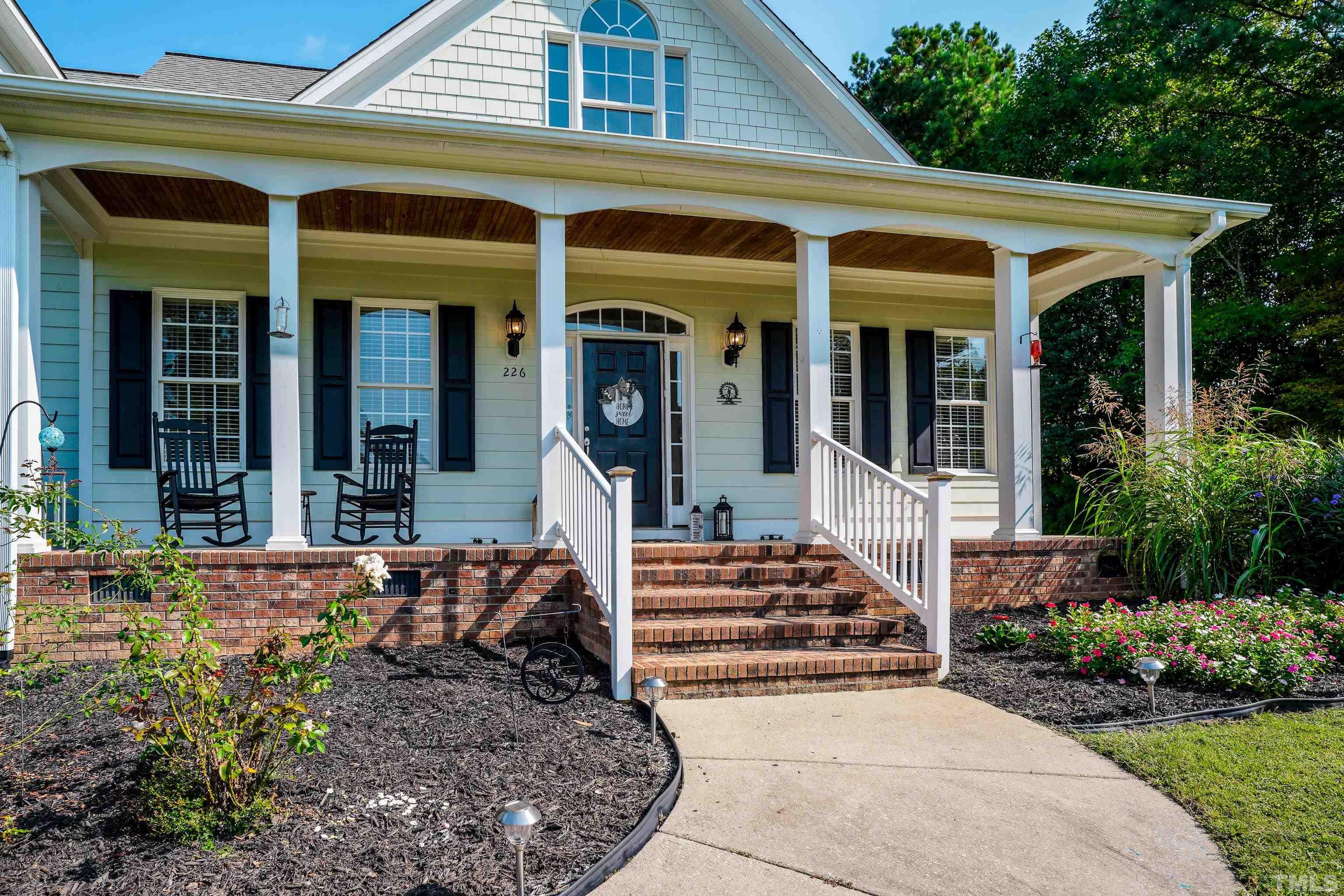 226 Fletcher Ridge Road Timberlake, NC 27583 - Photo 7 of 54 front view of a house with a porch