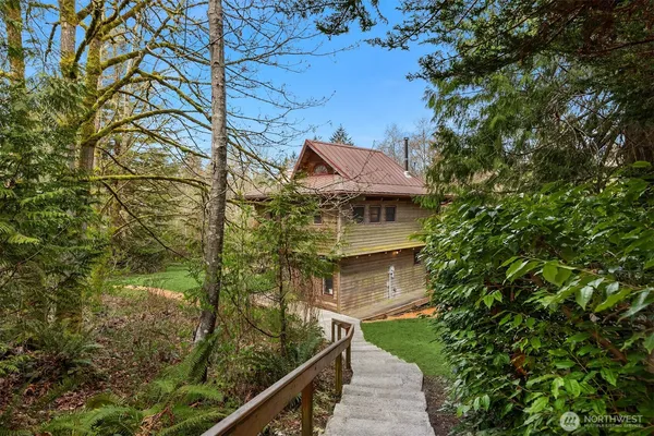 a aerial view of a house with a yard