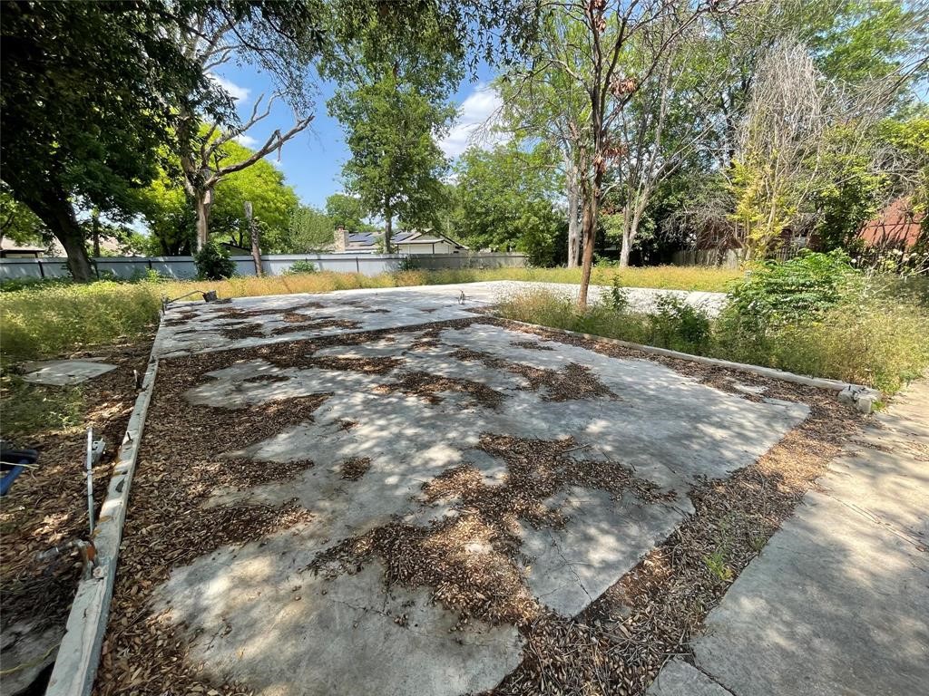 4502 Eric Circle Austin, TX 78744 - Photo 6 of 17 a view of a yard with plants and trees