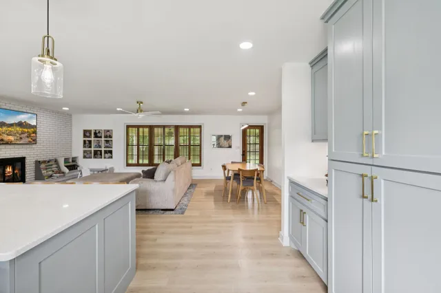 a view of a dining room with furniture and a rug