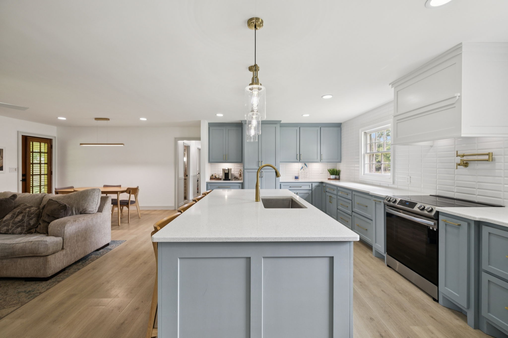 1005 Wilson Lane Pulaski, TN 38478 - Photo 22 of 71 a large kitchen with stainless steel appliances granite countertop a sink dishwasher a stove and a refrigerator with wooden floor