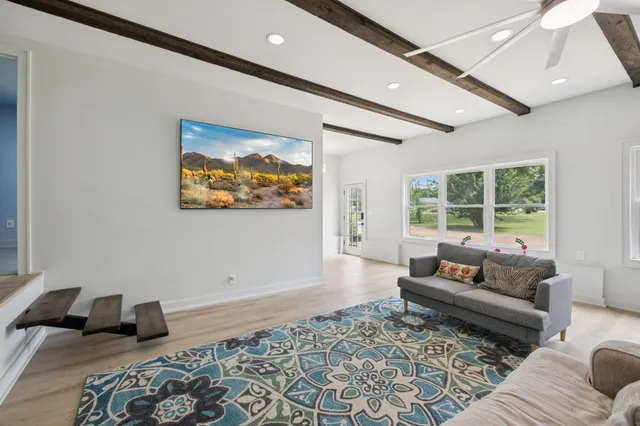 an aerial view of a houses with a lake