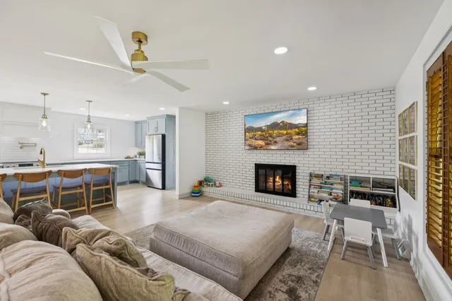 a kitchen with counter top space a sink and appliances