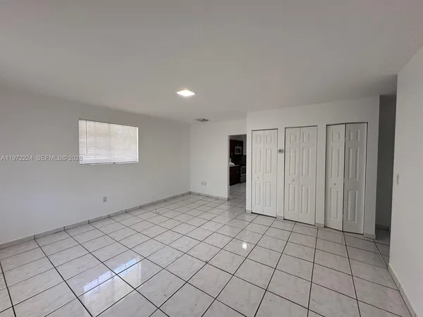 a view of an empty room and window