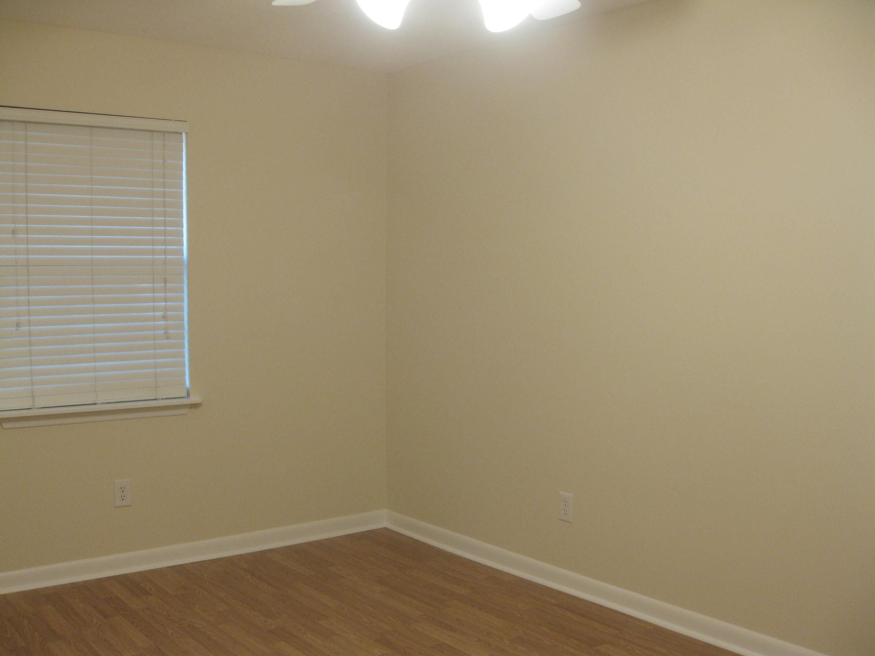 3310 Auburn Road Crestview, FL 32539 - Photo 15 of 44 a view of a small space with wooden floor and a window